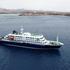 A drone view of the cruise ship MV Hondius, carrying passengers suspected of having cases of hantavirus on board, as it prepares to leave Praia