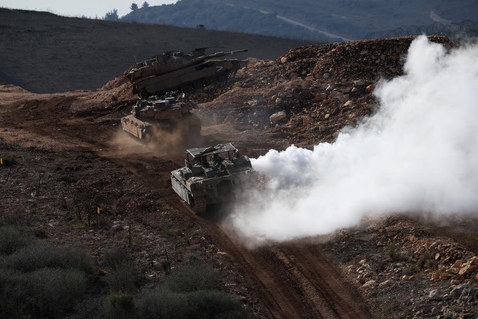 Israeli military vehicles manoeuvre along the Israel-Lebanon border as seen from northern Israel | Author: Shir Torem