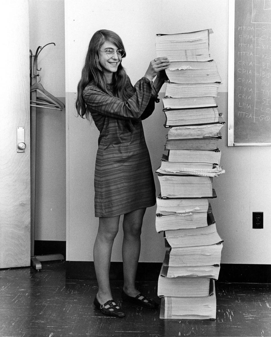 Margaret Hamilton, Margaret Elaine Hamilton, American computer scientist. Hamilton standing next to listings of the software she and her MIT team produced for the NASA Apollo project | Author: 