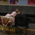 People take shelter inside a metro station during a Russian missile and drone attack, in Kyiv