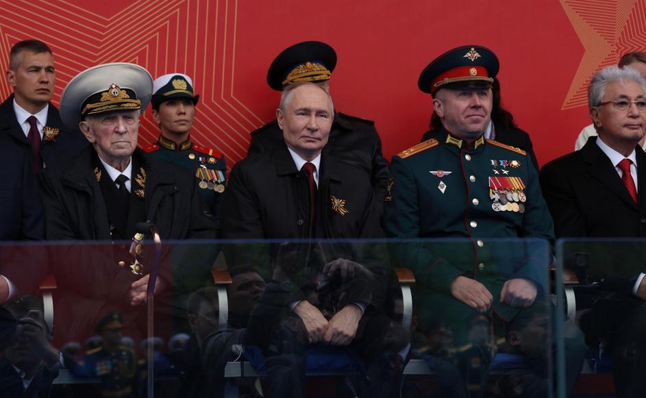 Moscow, Russia. 09th May, 2026. Russian President Vladimir Putin, center, sits with war veterans on the review stand during the annual Victory Day parade at Red Square, May 9, 2026 in Moscow, Russia. The annual parade is marking the 81st anniversary of th