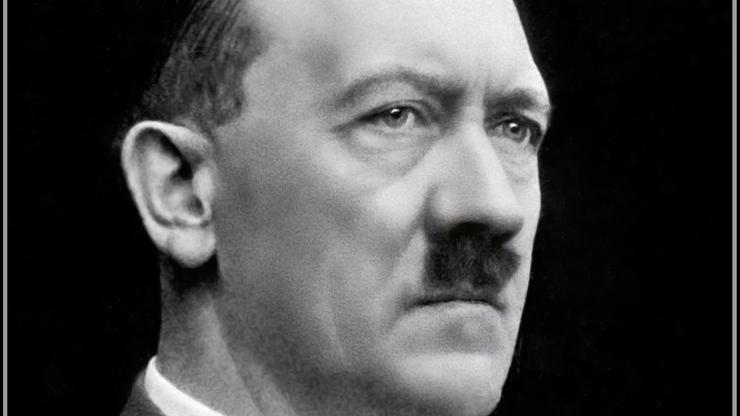 PORTRAIT ADOLF HITLER FACE Close portrait of Fuhrer Adolf Hitler by Heinrich Hoffman (personal photographer) black background, serious contemplative expression 1939