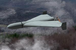 Russian military combat drone Shaheed flies over a forest, smoke from military action in Ukraine.