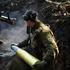 Ukrainian servicemen fire a self-propelled howitzer towards Russian troops at a frontline near the town of Chasiv Yar