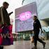 People walk past an electronic screen advertising Wildberries online retailer in Moscow