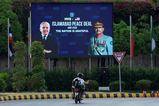 Billboard displaying portraits of Pakistan's Chief of Army Staff Field Marshal Asim Munir and Prime Minister Shehbaz Sharif, following a deal between the U.S. and Iran, in Islamabad