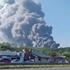 FILE PHOTO: Smoke rises after a Ukrainian drone attack on a Wildberries warehouse, in Novosemeykino