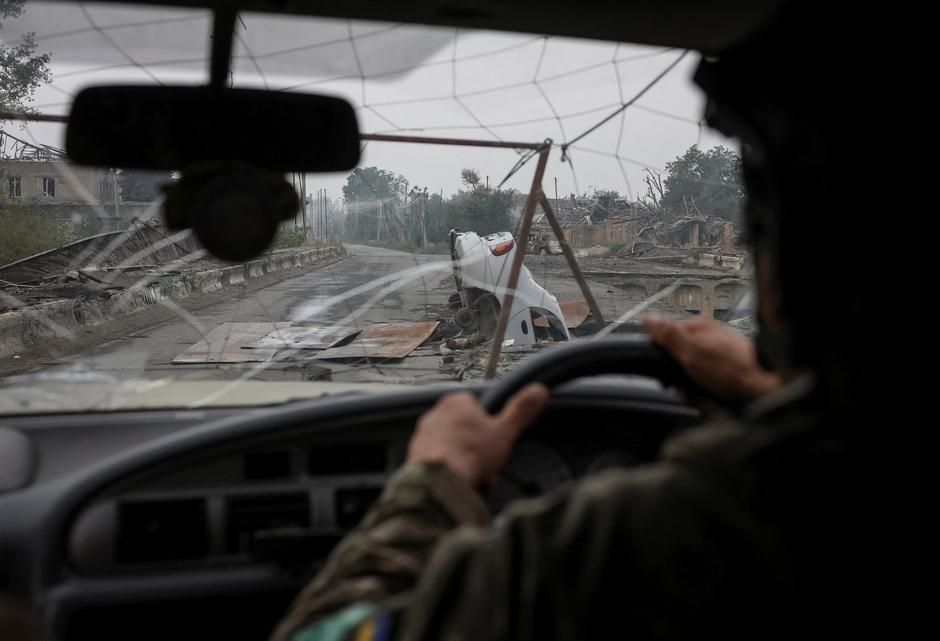 A Ukrainian serviceman drives a vehicle in the frontline town of Druzhkivka | Author: Anatolii Stepanov