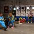 People shelter in a metro station during Russian missile and drone attacks in Kyiv