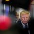 U.S. President Donald Trump speaks with members of the media on board Air Force One