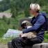 A woman holds a sheep, which was carried by helicopter in Wiler, near Blatten, Switzerland