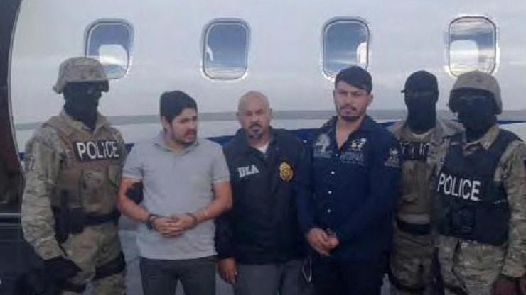 FILE PHOTO: Handout photo of Efrain Antonio Campo Flores and Franqui Fancisco Flores de Freitas stand with Haitian law enforcement officers in this November 12, 2015 photo after their arrest in Port Au Prince, Haiti.