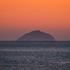 UK: WEATHER Troon , Ayrshire, Scotland 01st March 2022, the warm sun sets over ailsa craig and the goat fell tonight as we get closer to welcoming spring