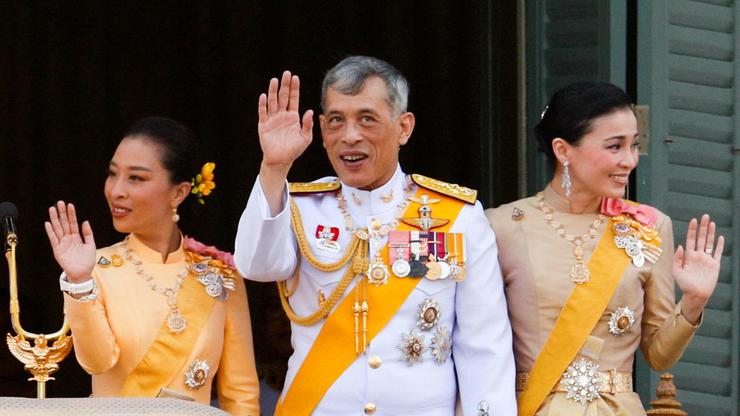 FILE PHOTO: Thailand's King Maha Vajiralongkorn, Queen Suthida and Princess Bajrakitiyabha wave from the balcony of Suddhaisavarya Prasad Hall at the Grand Palace