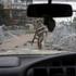 A Ukrainian serviceman walks on a street in the frontline town of Druzhkivka