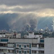 FILE PHOTO: Thick plumes of smoke with flames rise from an oil refinery in Moscow