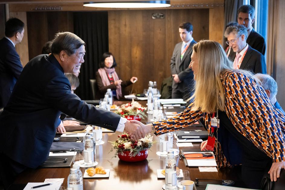 Chinese Vice Premier He Lifeng shakes hands with Switzerland's Director of the State Secretariat for Economic Affairs Helene Budliger Artieda before a bilateral meeting at the House of Switzerland