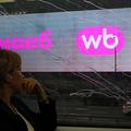 A woman rides a train past a screen advertising the Wildberries online retailer in Moscow