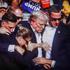 In this photo illustration, a screen shows Former US President Donald Trump shot in the ear at a rally he was holding in Butler. Former US President Donald Trump was wounded in a shooting at a rally he was holding in Butler, Pennsylvania as part of his el