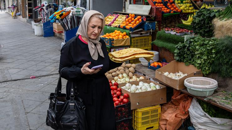 Tehranis shopping during bomb raids