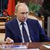 Russian President Vladimir Putin chairs a meeting on social issues, in Moscow