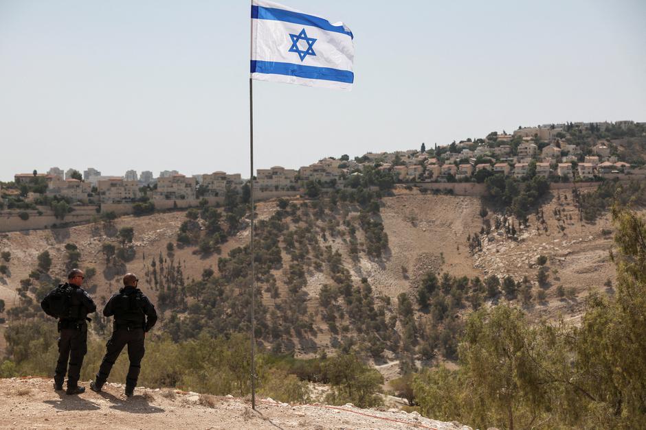 FILE PHOTO: Israeli flag flutters, as part of the Israeli settlement of Maale Adumim is visible in the background, in the Israeli-occupied West Bank | Author: Ronen Zvulun