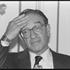 FILE PHOTO: Federal Reserve Board Chairman Alan Greenspan puts his hand to his head during press conf. at Spasso House, Moscow.