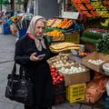 Tehranis shopping during bomb raids