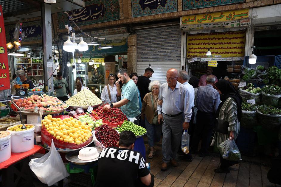 People walk at Tajrish Bazaar in Tehran