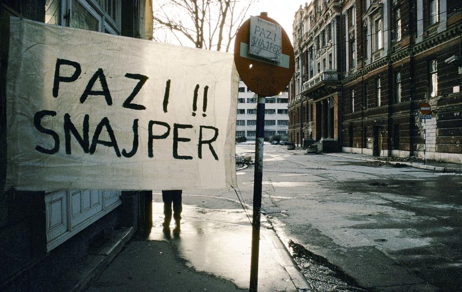 BEWARE SNIPER SIGN PAINTED ON WHITE SHEET IN SARAJEVO 1994