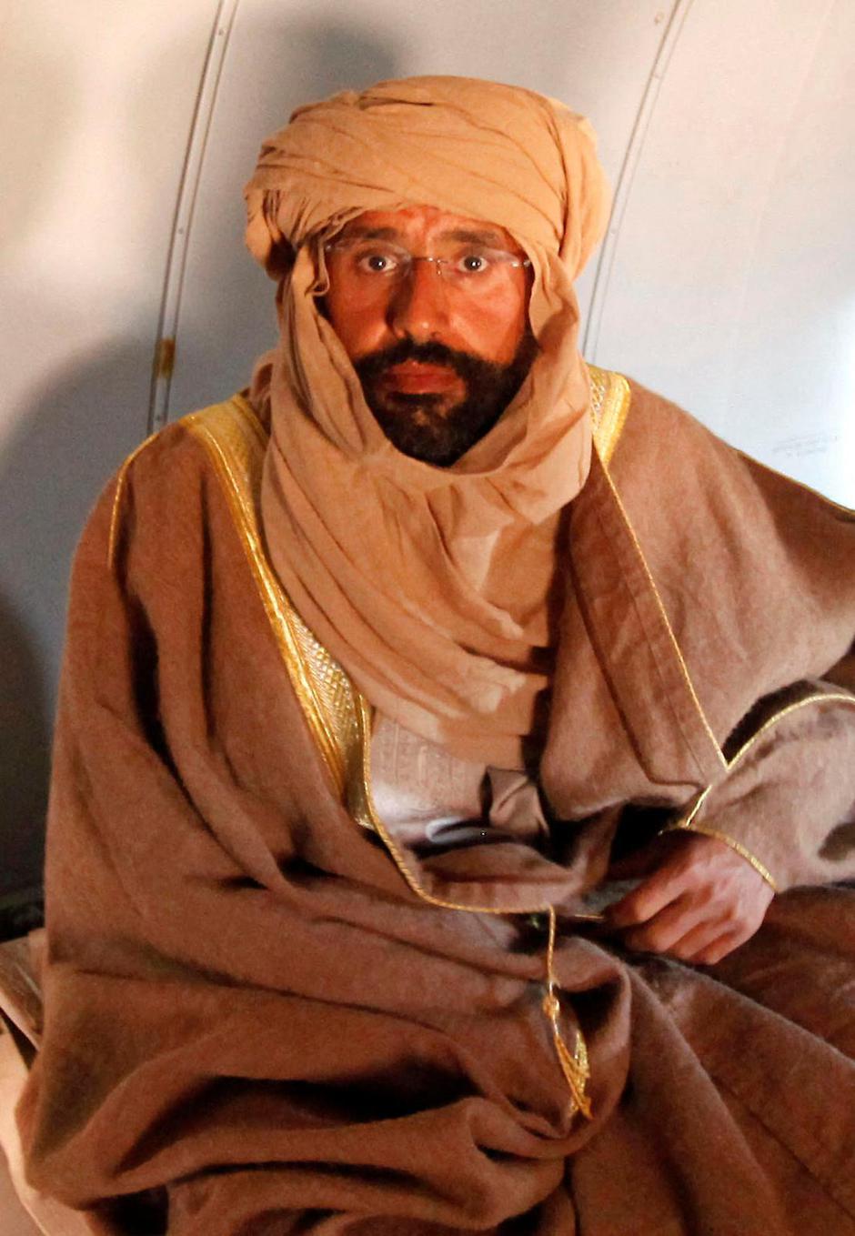 FILE PHOTO: Saif al-Islam Gaddafi is pictured sitting in a plane in Zintan | Author: ISMAIL ZETOUNI/REUTERS