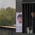 Person dressed up as US President Donald Trump performs inside mock prison cell in Tehran