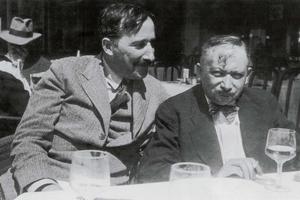 A photograph taken in the summer of 1936, featuring authors Stefan Zweig and Joseph Roth on the terrace of the Italian restaurant Almondo in Ostend. The photographer is believed to be Lotte Altmann, Stefan Zweig's lover and secretary at the time.