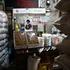 A poster with a picture of the late Supreme Leader of Iran, Ayatollah Ali Khamenei, is displayed in a store in Tehran
