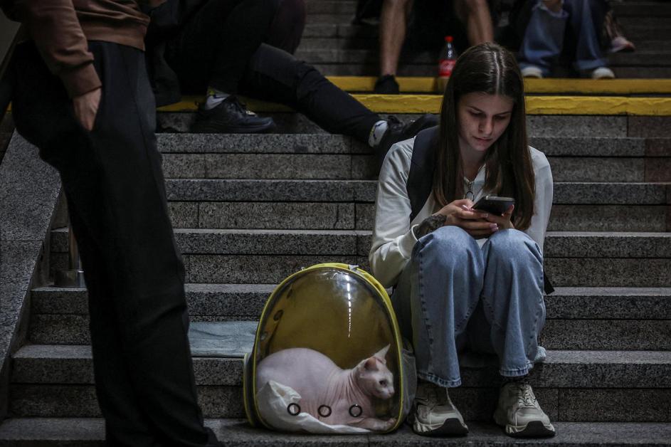 People take shelter during a Russian missile and drone strike, amid Russia's attack on Ukraine, in Kyiv