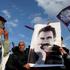 FILE PHOTO: A demonstrator holds a picture of jailed Kurdish militant leader Ocalan