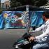 People drive past a banner with a picture of Iran's late Supreme Leader Ayatollah Ali Khamenei, in Tehran