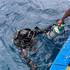 A diver from Finland takes part in a recovery operation for last two bodies of Italian scuba divers near Vaavu Atoll