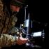 FILE PHOTO: Ukrainian serviceman prepares an FPV interceptor drone for a launch during his combat shift in Kharkiv region