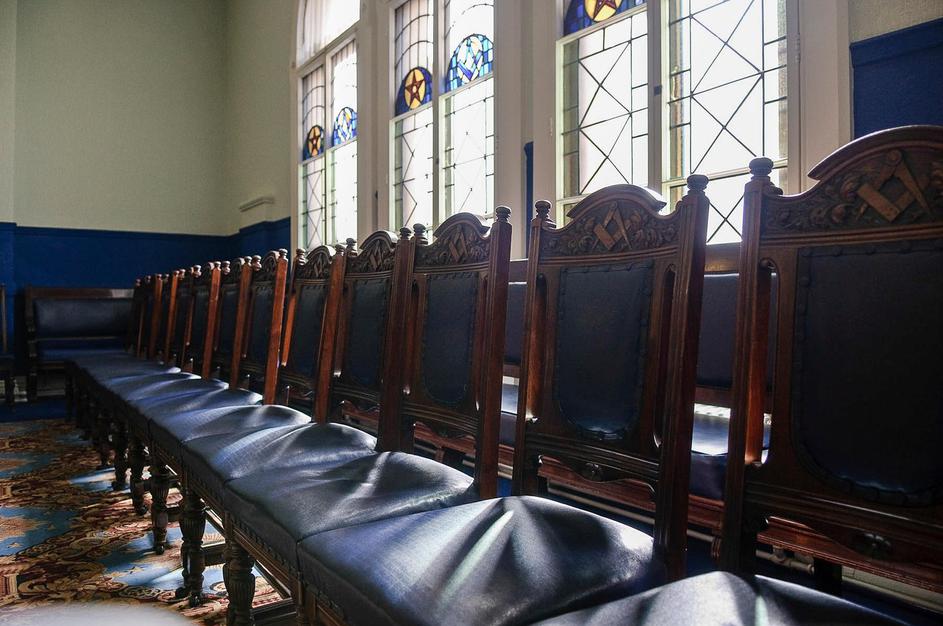 Empty seats in the Craft Room of a Masonic Hall.