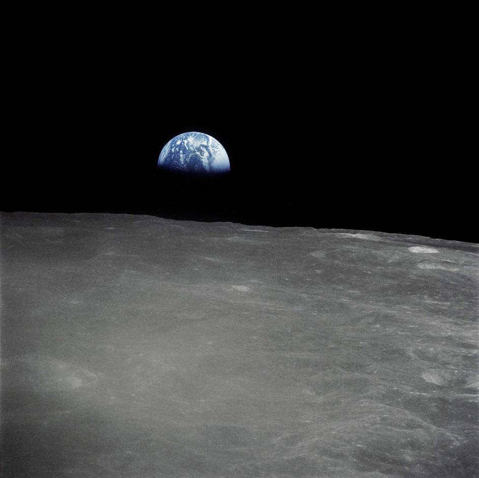 Earthrise - the crescent earth rising above the limb of the moon