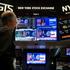 FILE PHOTO: Traders react to the Fed rate announcement on the floor of the NYSE in New York