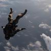 82nd Expeditionary Rescue Squadron is a U.S. Air Force unit performing a military free fall jump in Djibouti, Africa on April 17, 2018. The archival image records airborne operations and training for humanitarian and contingency missions under CJTF-HOA. T