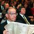 FILE PHOTO: ALAN GREENSPAN READS NEWSPAPER IN HONG KONG
