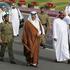 FILE PHOTO: Qatar's Emir Sheikh Hamad bin Khalifa al-Thani (C) walks beside members of a security team as he arrives to attend National Day celebrations in Doha
