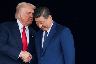 FILE PHOTO: U.S. President Donald Trump meets with Chinese President Xi Jinping on the sidelines of the APEC summit, in Busan
