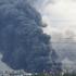 Thick plumes of smoke with flames rise from an oil refinery following a Ukrainian drone attack in Moscow