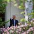 U.S. President Donald Trump gestures at the White House