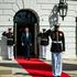 President Donald Trump walks along a red carpet outside the White House flanked by U.S. Marines and honor guards during a St. Patrick’s Day welcome ceremony for Irish Taoiseach Micheál Martin, Washington, D.C., March 17, 2026. Image courtesy of the White