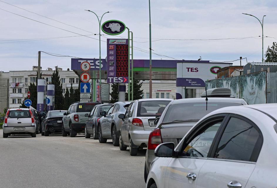 FILE PHOTO: Cars queue for fuel at a gas station in Sevastopol